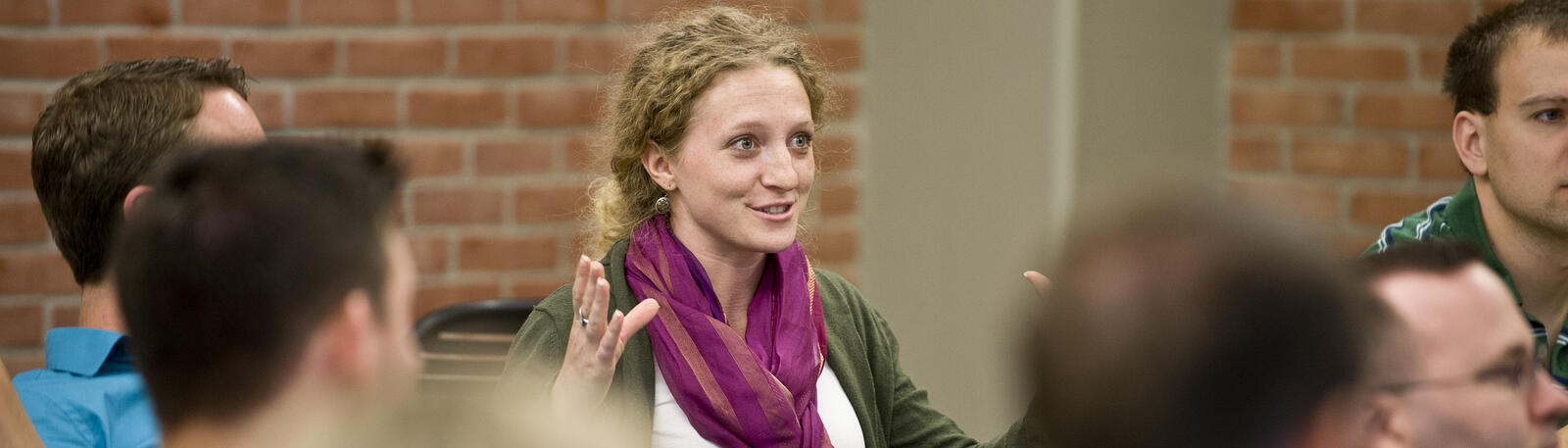photo of a student speaking in a classroom