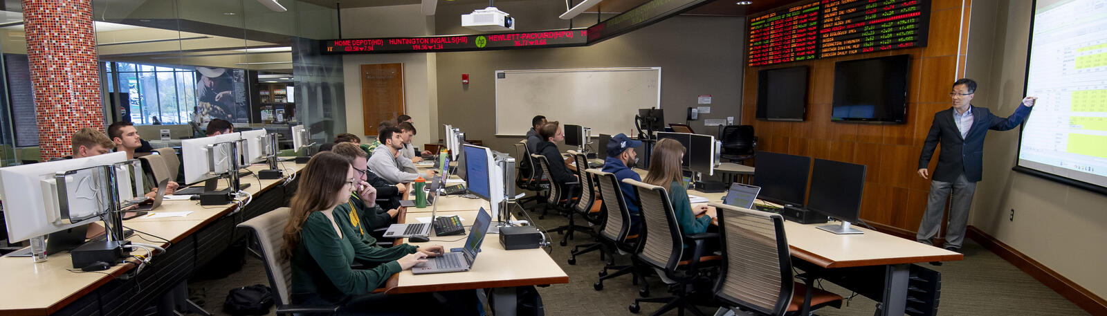 photo of students and a professor in a classroom